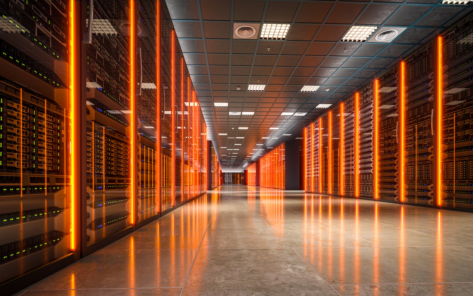Long data center corridor of server racks lit by warm orange light