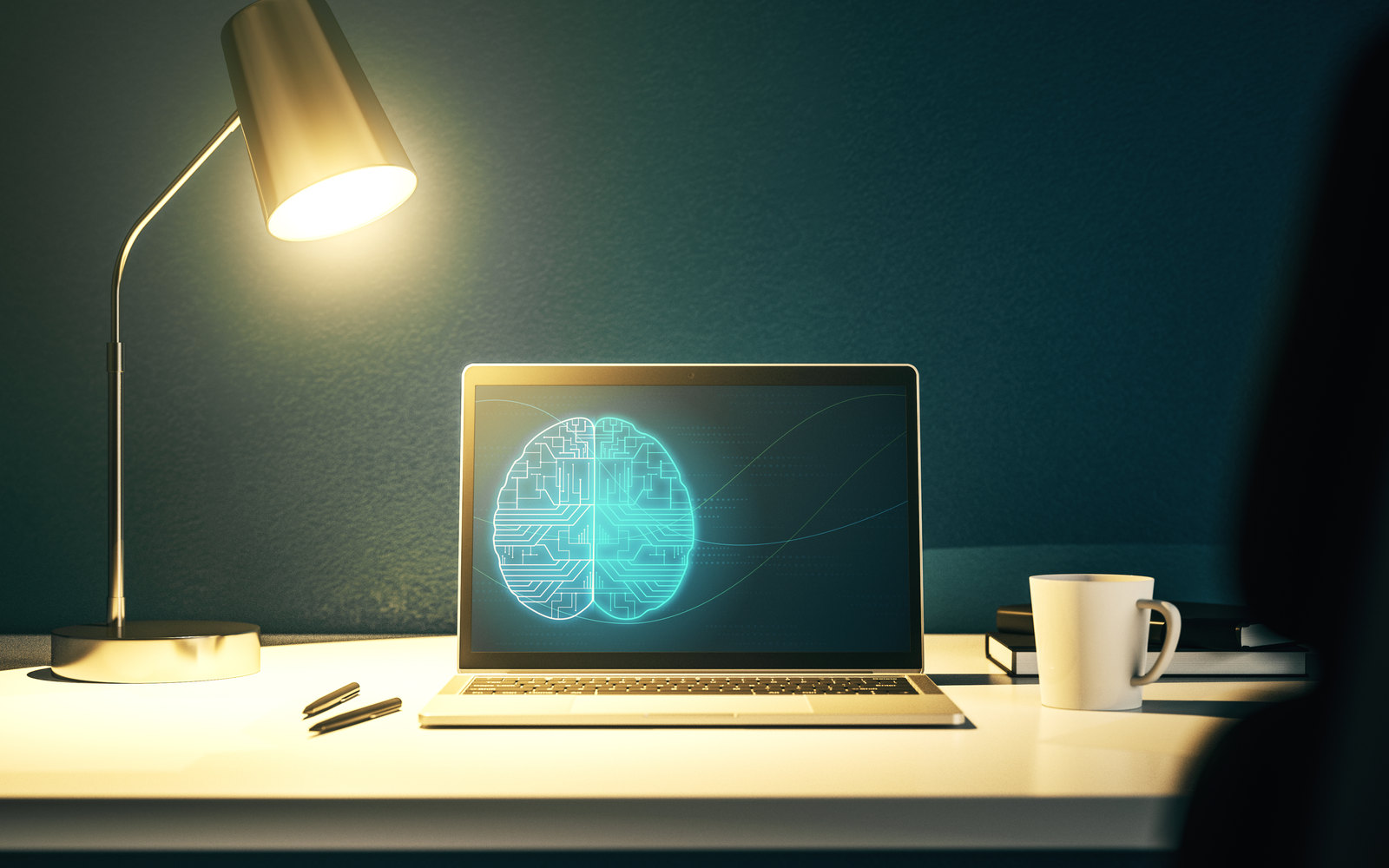 Laptop showing a glowing AI brain on screen beside a warm desk lamp